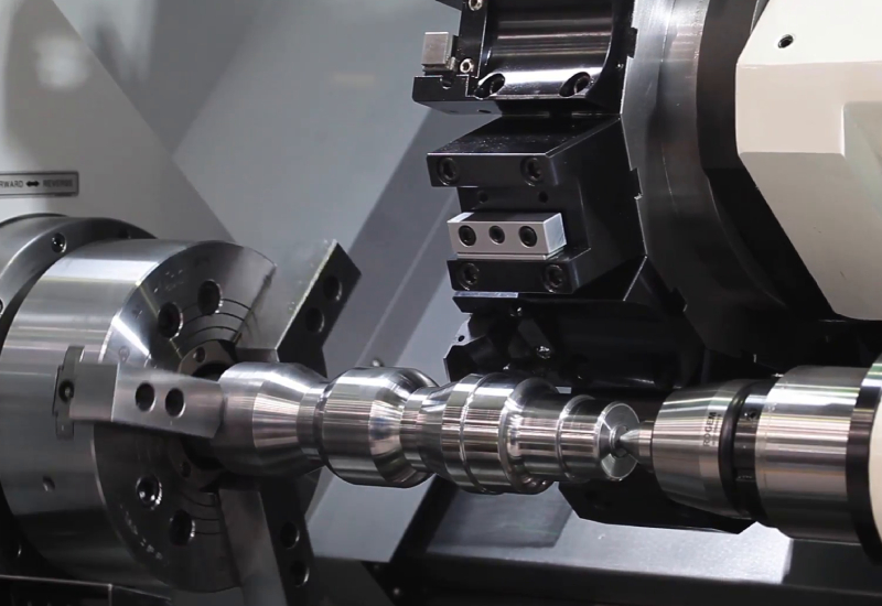 Team working on precision brass components